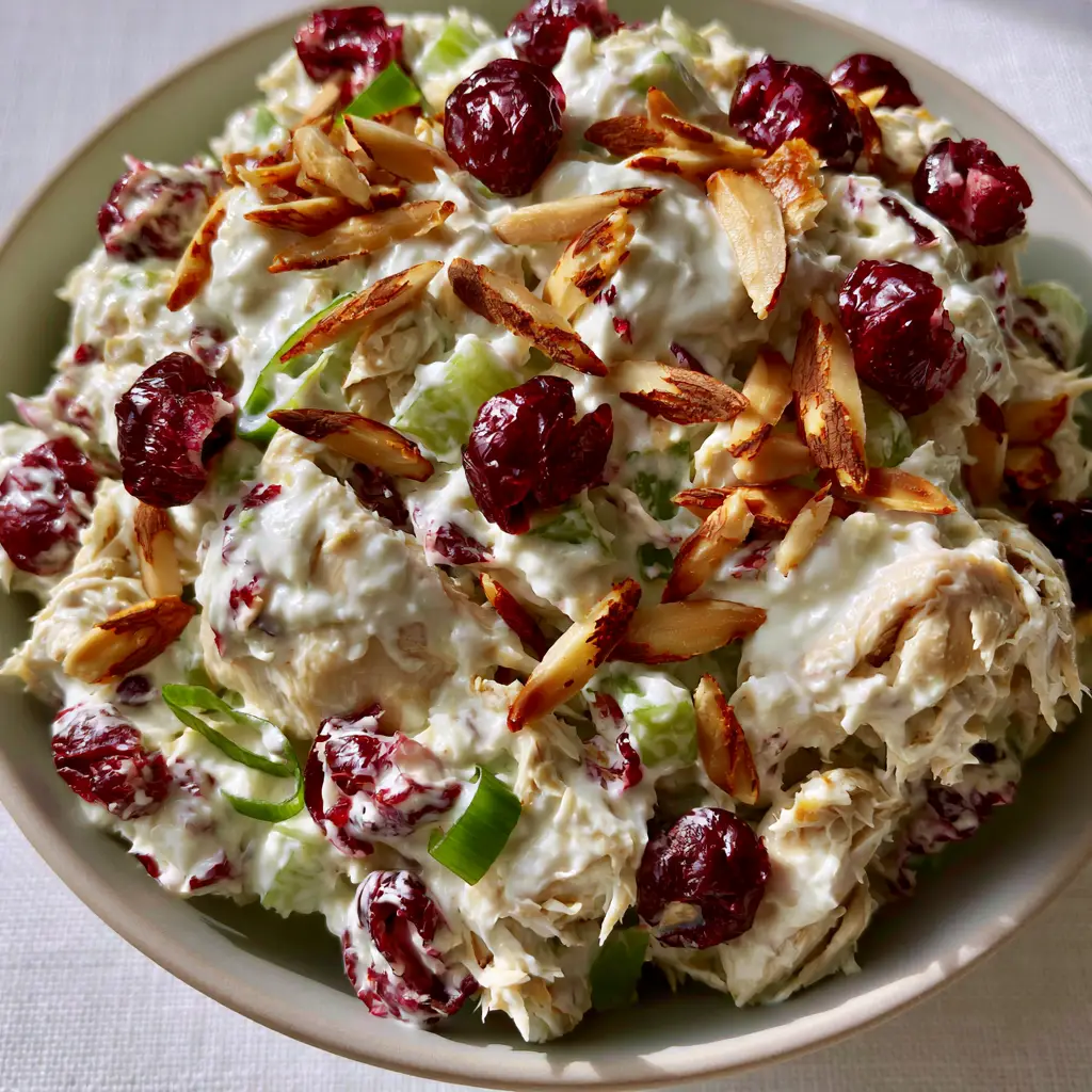 Cranberry Almond Chicken Salad with Creamy Greek Yogurt Dressing 2 Macro shot of cranberry almond chicken salad showing moist hand-shredded chicken and velvety dressing. (cranberry almond chicken salad)