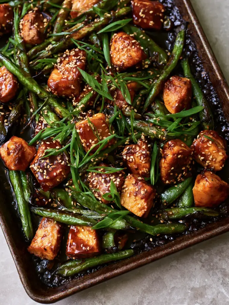 Teriyaki Chicken and Green Beans: The Ultimate Glossy Sheet Pan Dinner 1 Close up of roasted green beans with blistered spots and sesame seeds. (Teriyaki Chicken and Green Beans)