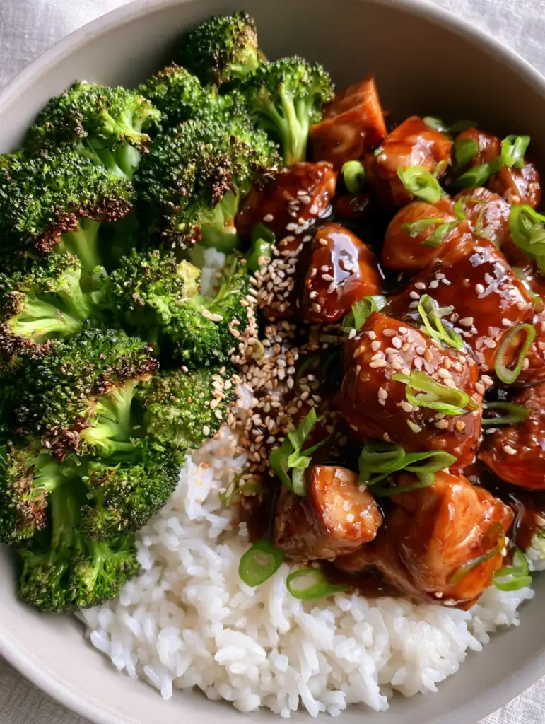 Teriyaki Chicken With Broccoli: The Ultimate Glossy Stir-Fry Guide 2 Extreme macro of glossy teriyaki chicken chunks and toasted sesame seeds. (Teriyaki Chicken With Broccoli)