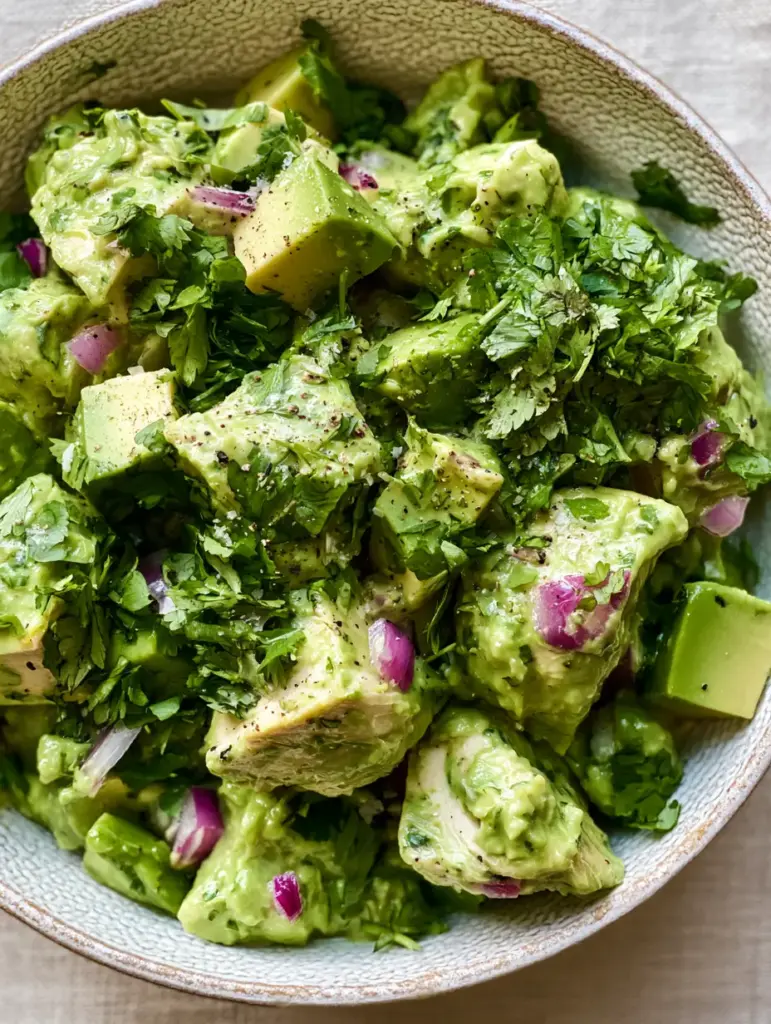Avocado Chicken Salad Recipe: The Ultimate Creamy and Healthy Gourmet Guide 2 Macro photo of avocado chicken salad with visible flecks of sea salt, cracked black pepper, and fresh cilantro leaves. (avocado chicken salad)